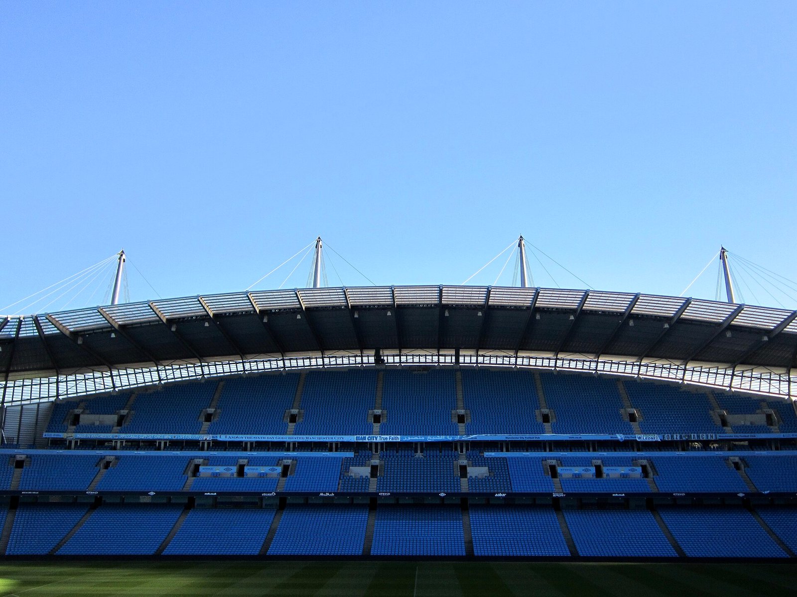 A stand at the Etihad Stadium under a clear sky